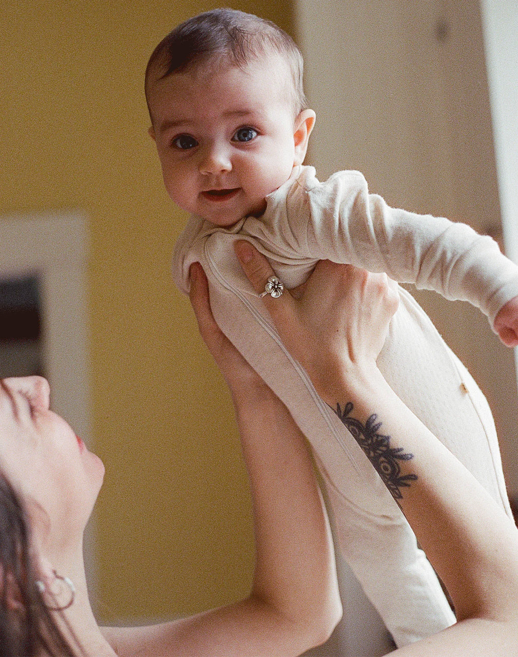 ORGANIC POINTELLE FOOTIE SLEEPER - OAT MILK